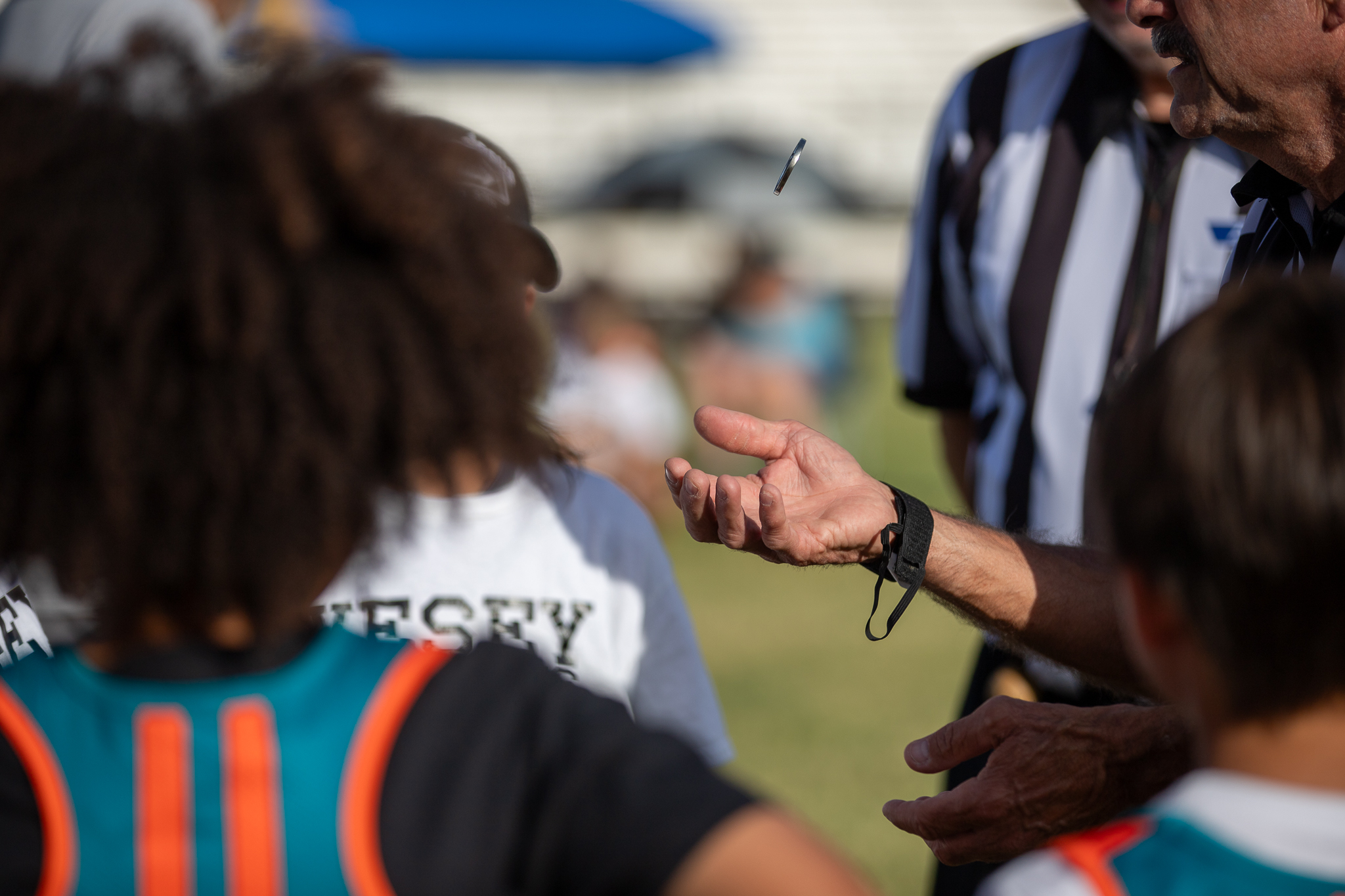 The referee does the coin toss before the game starts