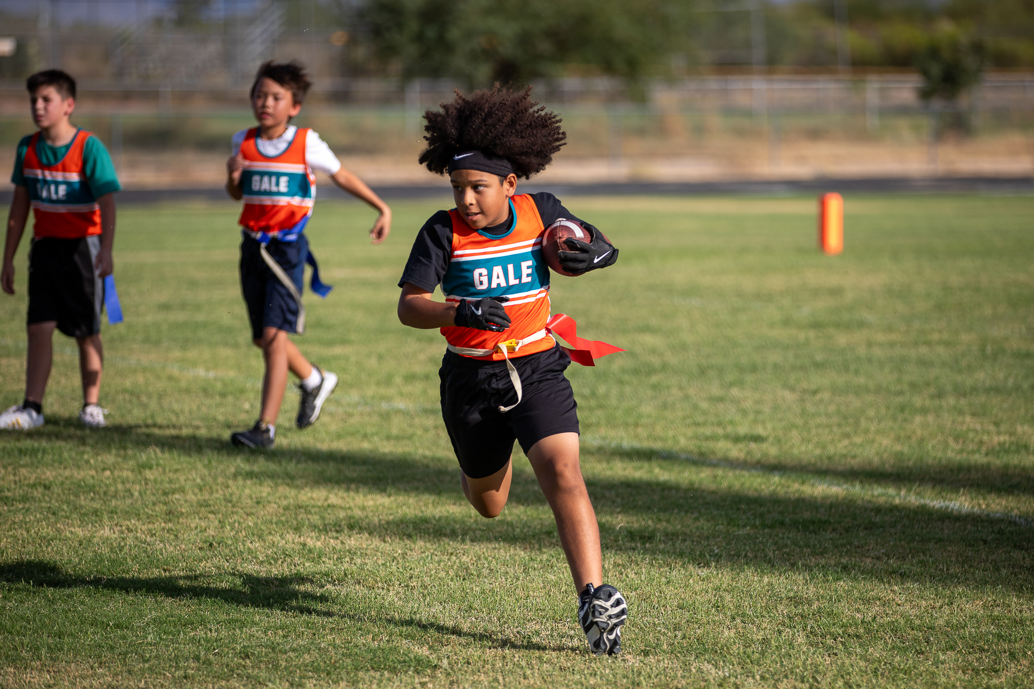 A Gale player runs with the football under his arm